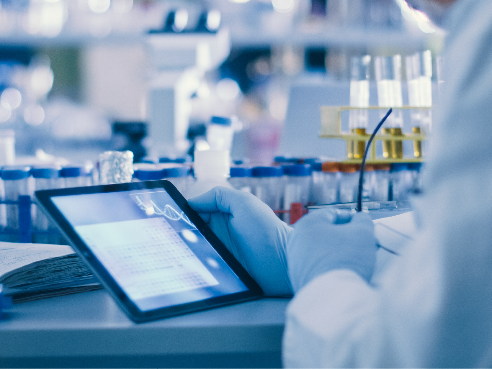 This is a photograph of a cancer researcher analysing research data to represent the STCC's Impact & Population Health platform.